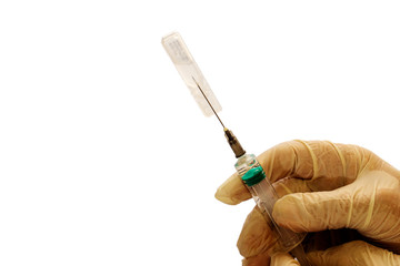 Medicine from an ampoule is drawn into a syringe. Habitual action of a medical professional