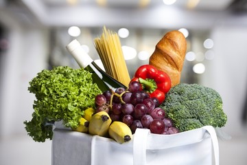 Full shopping bag with vegetable on blur  background