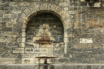 Old Jewish lavatory inside the Cemetery in Prague, Czech Republic.  Ritual to wash the hands with...