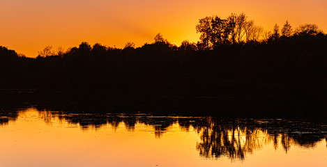 Beautiful sunset with reflections near Niederpöring, Isar, Bavaria, Germany