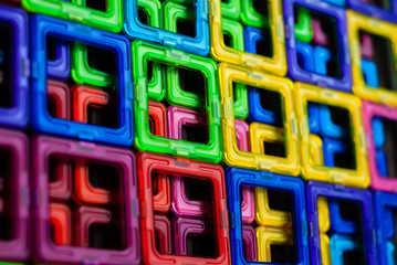 Pattern (background) of colored squares of the magnetic constructor; geometric figures