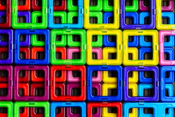 Pattern (background) of colored squares of the magnetic constructor; geometric figures