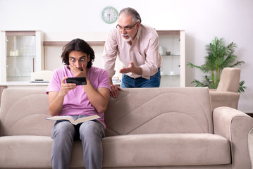 Obraz premium Young student and his father