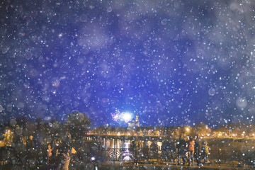 snow in a night city skyscrapers / seasonal landscape winter city, snowfall against a background of skyscrapers