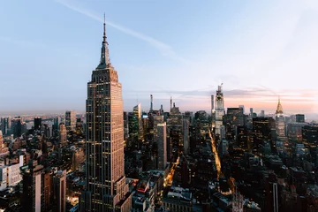 Fototapeten Empire States und Wolkenkratzer in New York City, USA © Temi Ogunwumi/Wirestock