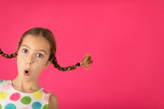 Portrait of fancy girl against pink background