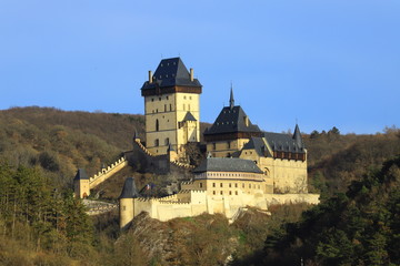 Fototapeta na wymiar Karlstejn is a medieval castle on the slopes of a high cliff