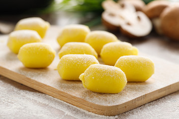 Raw stuffed gnocchi with mushroom filling