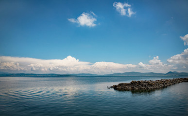 Rocky breakwater, Lake Trasimeno, Umbria, Italy