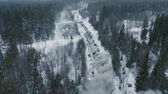 Black smoke from steam train in forest