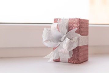 Holiday. Gift box decorated bow