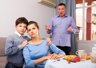 Ordinary family with teen son having quarrel at home