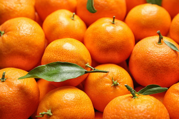 Delicious fresh ripe tangerines as background, closeup
