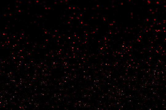 Red Glitter Bokeh Lights On Black Background, Unfocused. Holiday Time. Overlay Layer