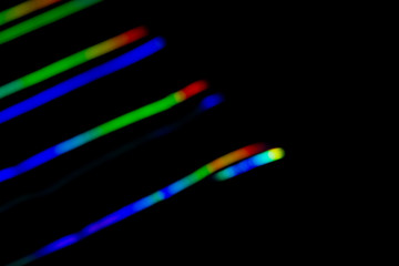 Fototapeta premium Holographic background with different colors. Holographic lines on black background. Neon line. overlay layer.