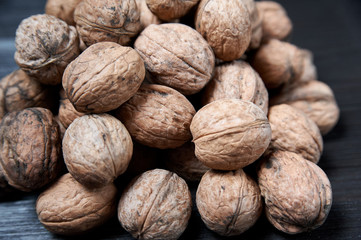 walnut on a black wooden background still life, walnut