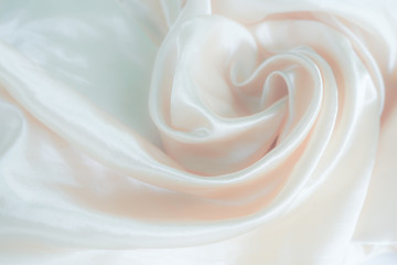 Defocused luxury silk background. Delicate pastel shade. Pastel colors, concept of comfort and sexuality.