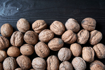 walnut on a black wooden background still life, walnut