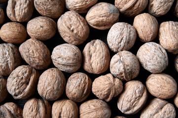 walnut on a black wooden background still life, walnut
