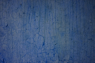 Background from old boards with cracked colored paint. Blue shades.