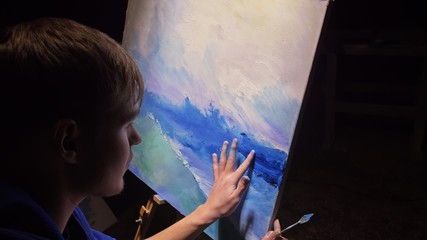 Artist copyist paint seascape with ship in ocean. Craftsman decorator draw as boat sail on blue sea...