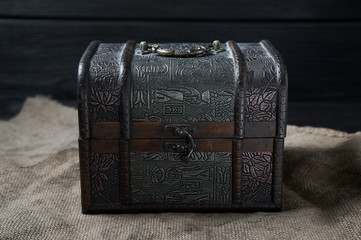old wooden decorative chest on a black background