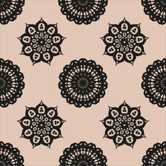 Seamless ethnic pattern with floral motives. Mandala stylized print template for fabric and paper. Boho chic design. Summer fashion.