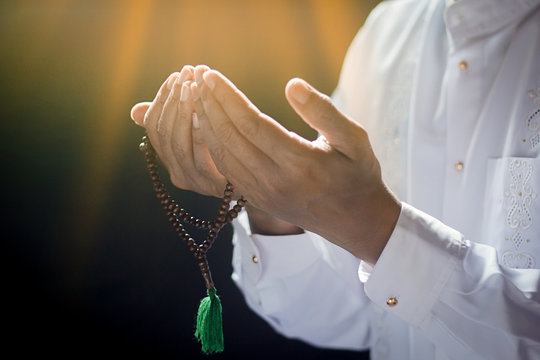Muslim man praying in the house.