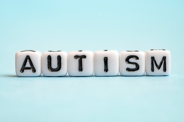 Autism word on white cubes