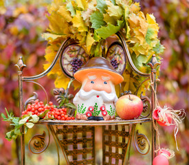 colorful juicy autumn decor with a mushroom toy on a shelf in the park