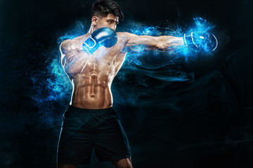 Boxing and fitness concept. Boxer man fighting or posing in gloves on black background. Individual...