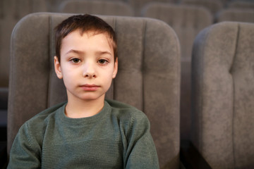 Kid posing in theater