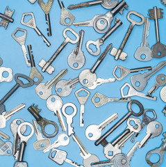 Keys set on blue background. Door lock keys and safes for property security and house protection....
