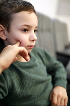 Pensive kid watching performance