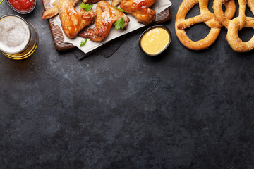 Hot chicken wings and draft beer