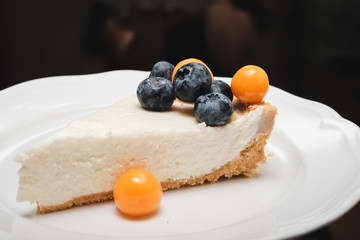 slice of cheesecake on a plate. Homemade pie. Creamy slice.