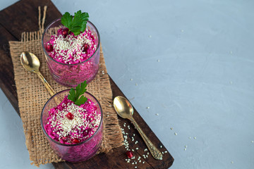 Holiday salad of beets and soft cheese in glasses. Added sesame seeds and chanok.