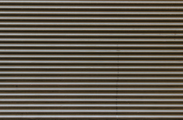 Obraz premium Texture of a wave-shaped brown plastic panel