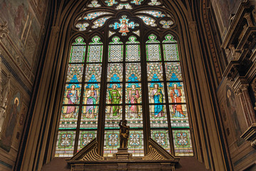 Fototapeta premium Stained glass inside St. Vitus's Cathedral in Prague Castle, Czech Republic. Gothic ornamental details of St. Vitus Cathedral 