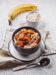 Oatmeal with fried banana. White background table