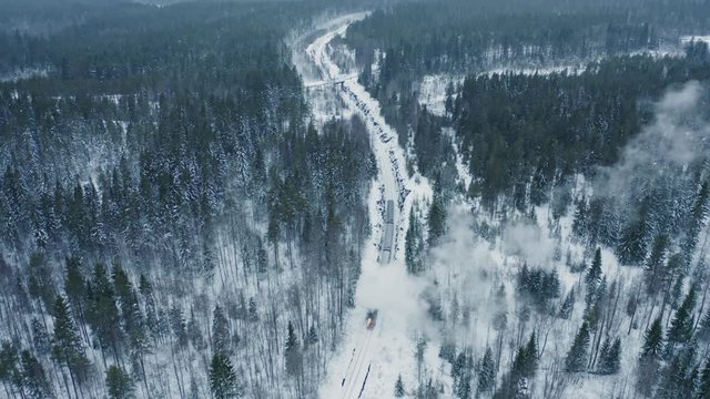 Aerial view steam train in snowy forest