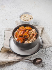Oatmeal with fried banana. White background table