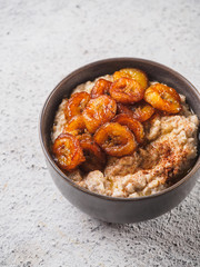 Oatmeal with fried banana. White background table