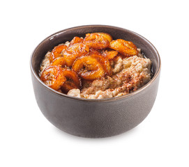 Oatmeal with fried banana. White isolated background