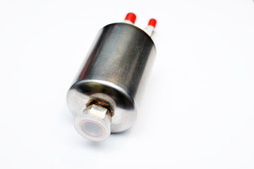 A new fuel filter car enclosed in a metal casing with an inlet and outlet on fuel lines on a white background