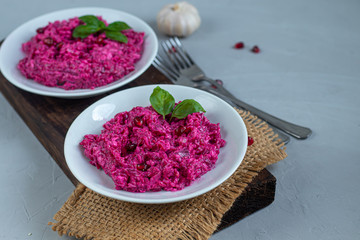 Holiday salad of beets and soft cheese. Added sesame seeds and chanok. Vegetarian food. Healthy food.