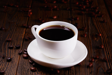 a cup of espresso on a wooden table