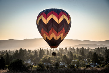 hot air balloon launching in the mountains of Napa valleyy 