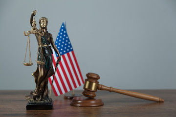 american flag with judge on desk