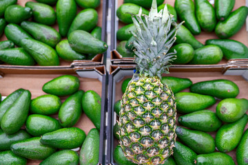Fresh pineapple on shelves in supermarket.